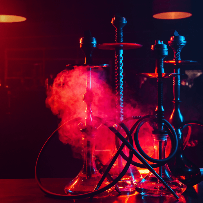 Friends enjoying shisha, music and drinks